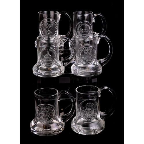 249 - A quantity of Dartington glass commemorative Christmas mugs.