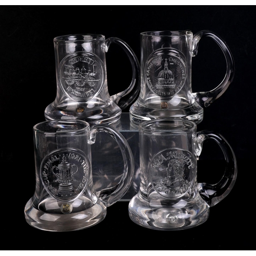 250 - A quantity of Dartington glass commemorative Christmas mugs.