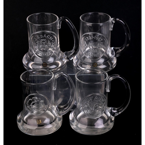 250 - A quantity of Dartington glass commemorative Christmas mugs.