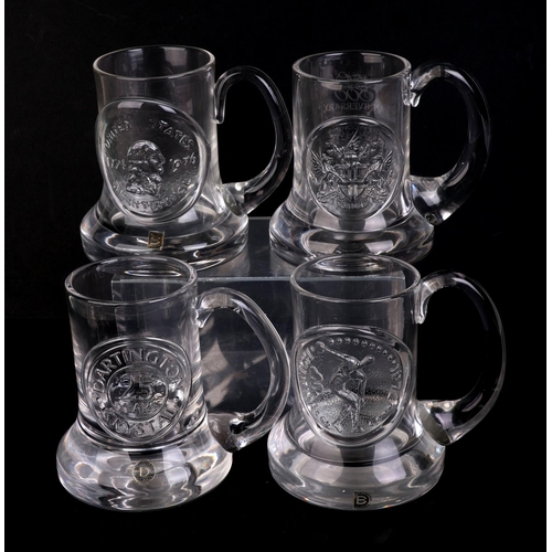 250 - A quantity of Dartington glass commemorative Christmas mugs.