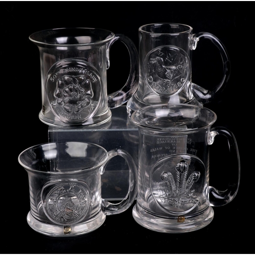 250 - A quantity of Dartington glass commemorative Christmas mugs.