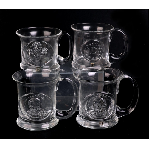 250 - A quantity of Dartington glass commemorative Christmas mugs.