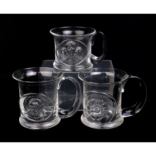 250 - A quantity of Dartington glass commemorative Christmas mugs.