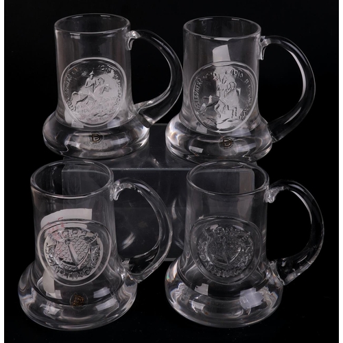 251 - A quantity of Dartington glass commemorative Christmas mugs.