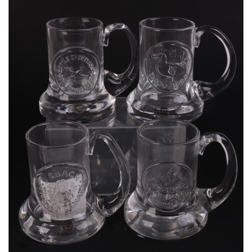 251 - A quantity of Dartington glass commemorative Christmas mugs.