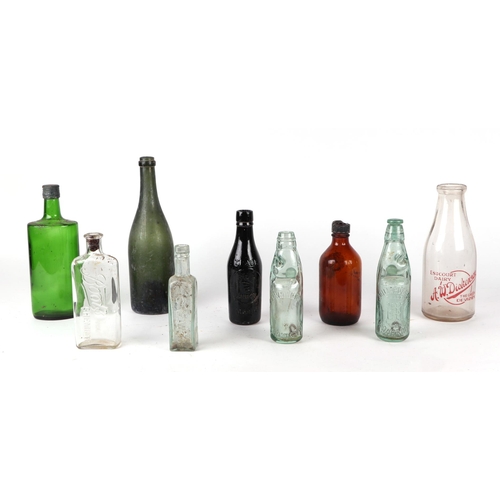 252 - A small quantity of Victorian and later glass bottles M. Millard & Sons, Trowbridge Codswallop examp... 