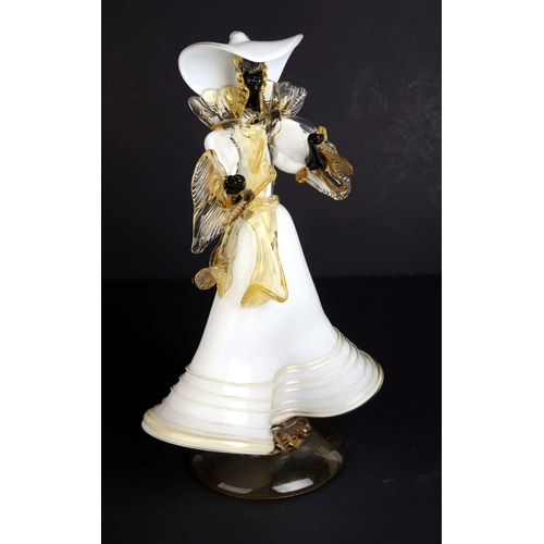 253 - An Italian Murano Art glass figure depicting a woman in a long flowing dress, 37cms high.