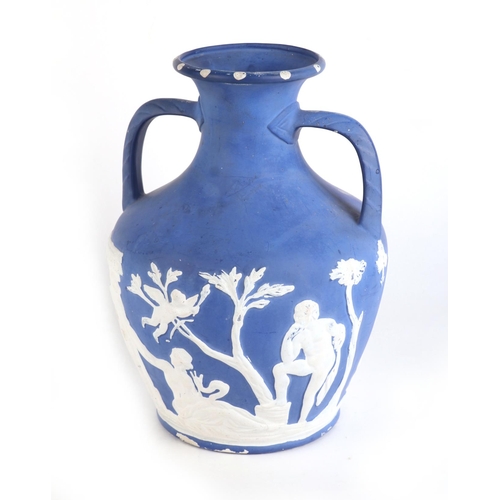 255 - A Jasperware style Portland vase decorated with classical figures, 28cms high.