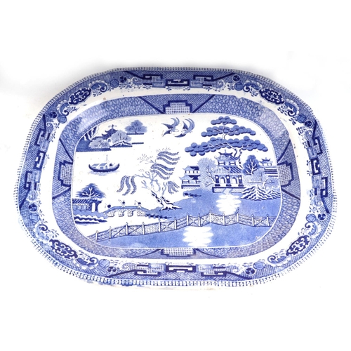 268 - A blue & white transfer printed pottery meat plate, 46cms wide; together with three similar meat pla... 