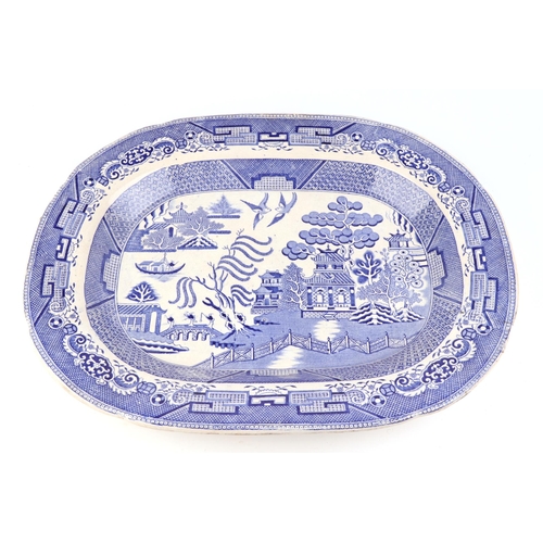 268 - A blue & white transfer printed pottery meat plate, 46cms wide; together with three similar meat pla... 