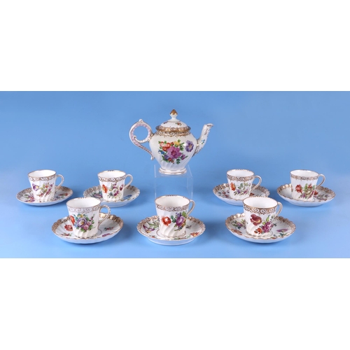 274 - Seven Dresden cups and saucers decorated with flowers; together with a Dresden teapot.Condition Repo... 