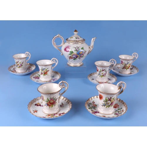 275 - Six Dresden cups and saucers decorated with flowers, together with a similar Dresden teapot.Conditio... 