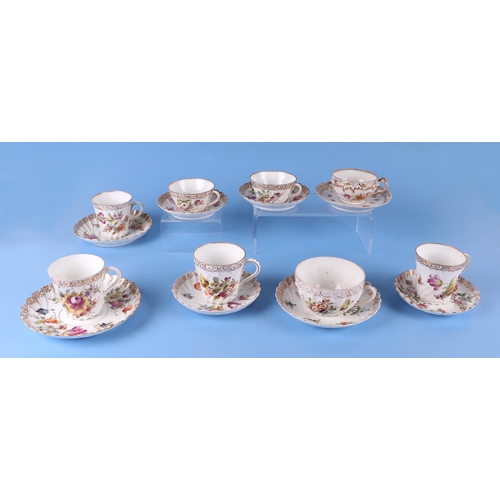 276 - A quantity of Dresden cups and saucers decorated with flowers.