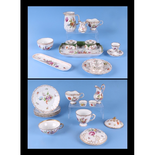 278 - A quantity of Dresden porcelain to include a desk stand, cream jug, plates and other items.