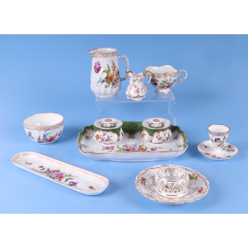 278 - A quantity of Dresden porcelain to include a desk stand, cream jug, plates and other items.