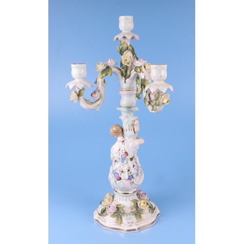 284 - Three continental porcelain figural three-armed candelabra with encrusted flower decoration, 52cms h... 