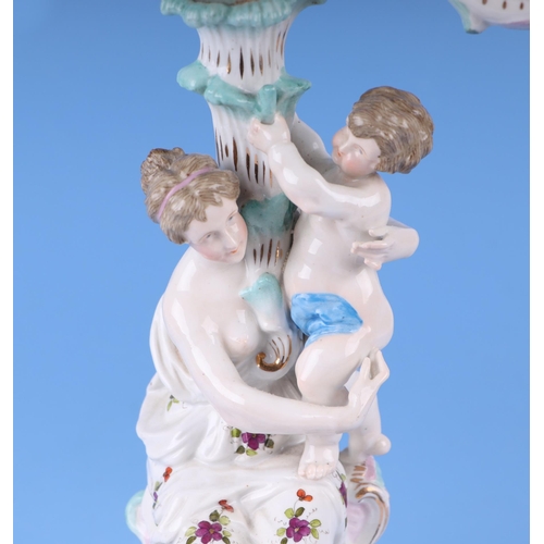 284 - Three continental porcelain figural three-armed candelabra with encrusted flower decoration, 52cms h... 