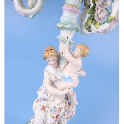 284 - Three continental porcelain figural three-armed candelabra with encrusted flower decoration, 52cms h... 