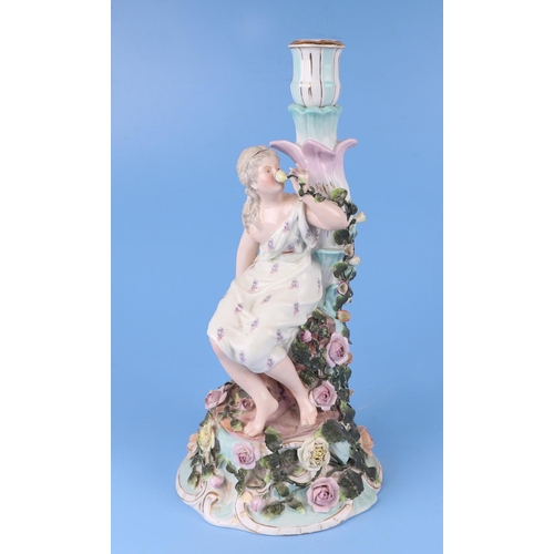 285 - A pair of continental porcelain figural candelabra with flower encrusted decoration (one lacking can... 