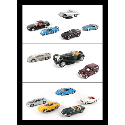 29 - A small quantity of 1:18 scale diecast models to include Bburago Mercedes Benz 300SL, Porsche 911, J... 