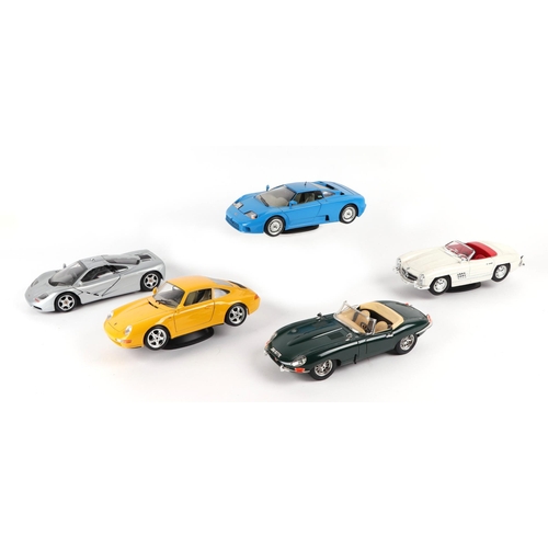 29 - A small quantity of 1:18 scale diecast models to include Bburago Mercedes Benz 300SL, Porsche 911, J... 