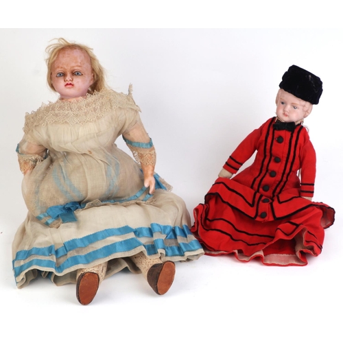 290 - A Victorian wax headed doll with blue glass eyes, wax forearms and legs, approximately 50cm high; to... 