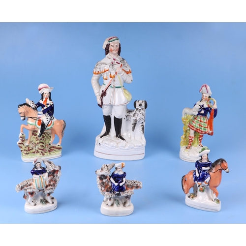 291 - A large quantity of Staffordshire pottery figures and groups, the largest 35cms high.