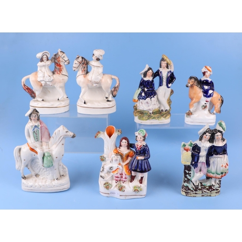 291 - A large quantity of Staffordshire pottery figures and groups, the largest 35cms high.