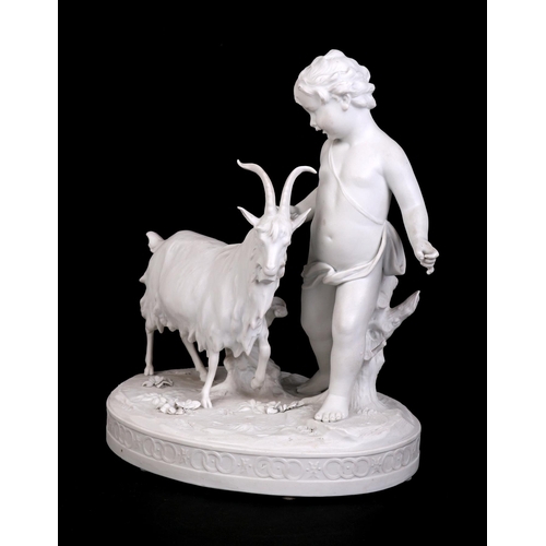 310 - A Parian figural depicting a young boy with a goat, 20cms wide.