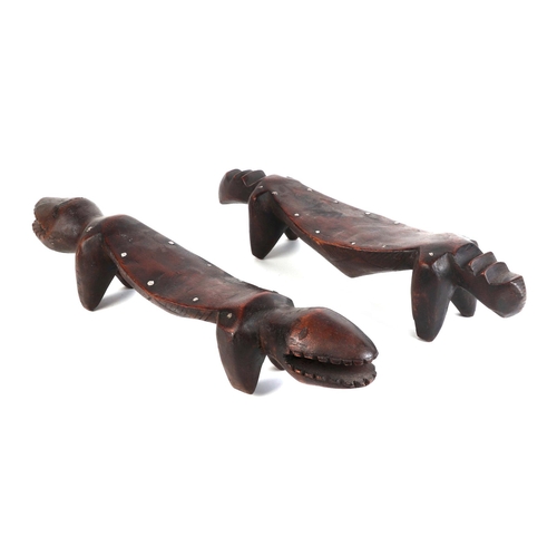 321 - Six African Ivory Coast Senufo zoomorphic carved hardwood head rests, the largest 52cms long (6).