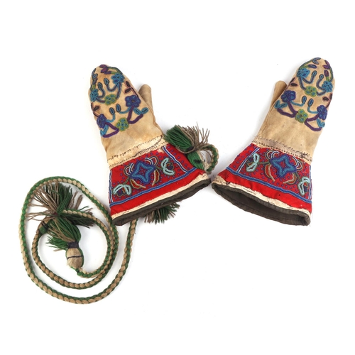 322 - A pair of late 19th / early 20th century Native American gloves with beadwork decoration.