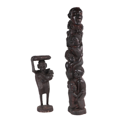 324 - An African carved hardwood fertility figure depicting a lady carrying a child with a basket on her h... 