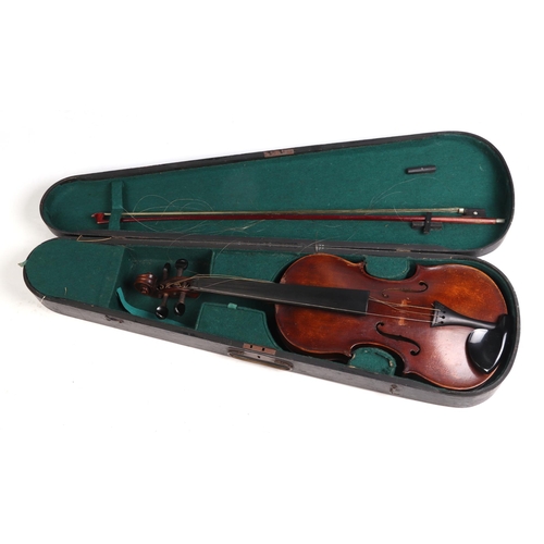 351 - A one-piece back violin & bow, the back 36cms (14ins) long, cased.