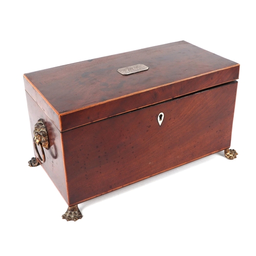 356 - A Regency mahogany tea caddy with two internal compartments and mixing bowl, on lion paw feet, 31cms... 