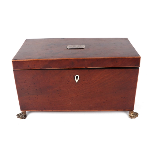 356 - A Regency mahogany tea caddy with two internal compartments and mixing bowl, on lion paw feet, 31cms... 