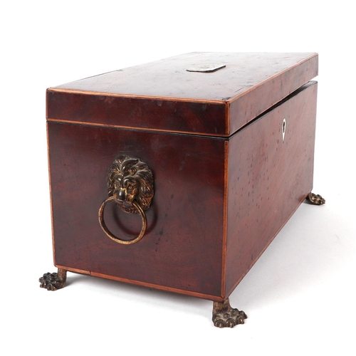 356 - A Regency mahogany tea caddy with two internal compartments and mixing bowl, on lion paw feet, 31cms... 