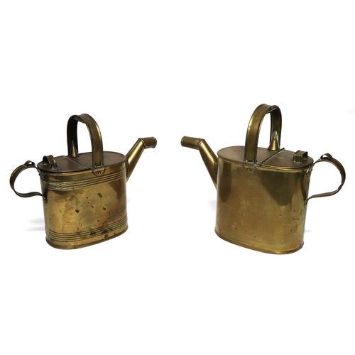 381 - A brass water can, 28cms high; together with another, 25cms high (2).