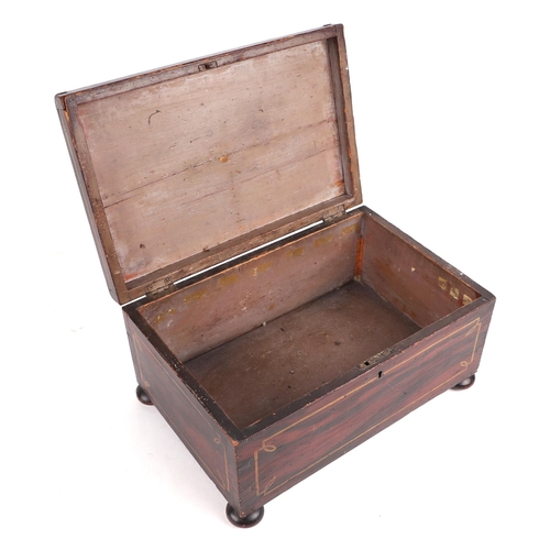 385 - A 19th century faux rosewood workbox of sarcophagus form, on bun feet, 31.5cms wide.