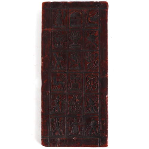 390 - A moulded wax printing block, 22 by 10cms.