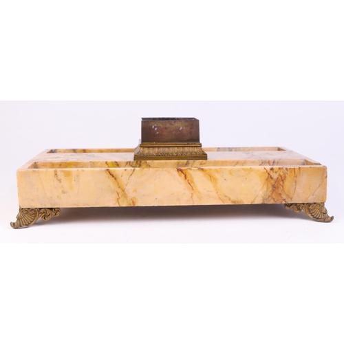 392 - A late 19th century Sienna marble desk stand with twin pen recesses and bronze lion paw feet, 34cms ... 