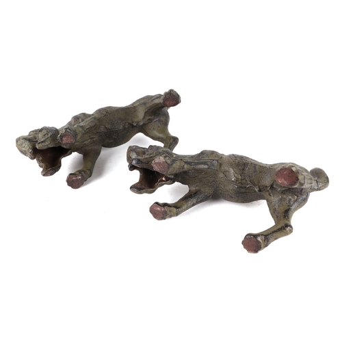 414 - A pair of patenated iron bloodhounds, 24cms long; together with a pair of patinated lurchers, 36cms ... 