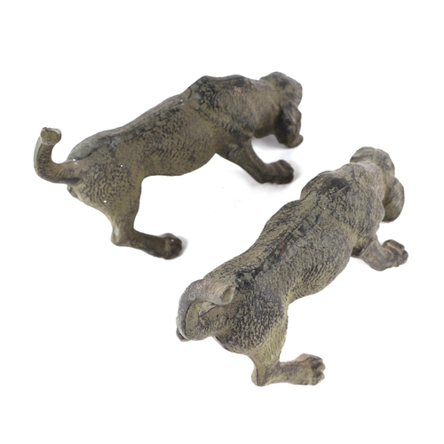 414 - A pair of patenated iron bloodhounds, 24cms long; together with a pair of patinated lurchers, 36cms ... 