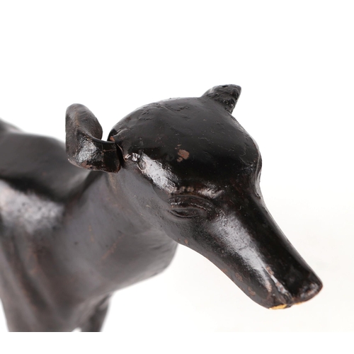 414 - A pair of patenated iron bloodhounds, 24cms long; together with a pair of patinated lurchers, 36cms ... 