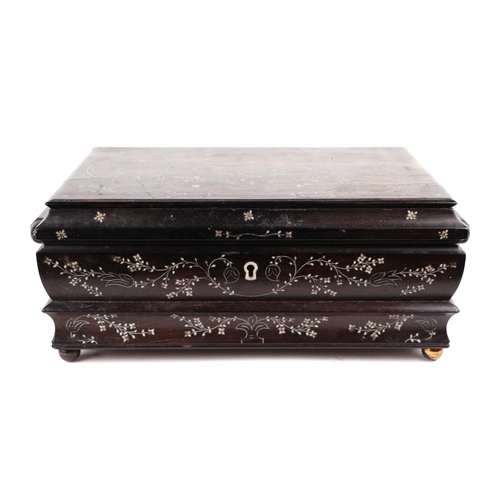 415 - A Victorian Anglo-Indian hardwood table top casket with inlaid ivory decoration, 30cms wide.   Ivory... 