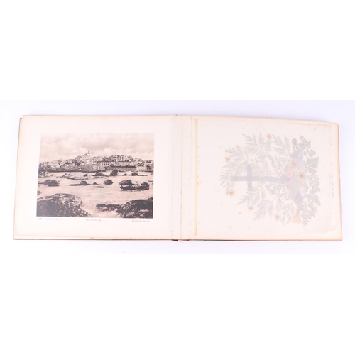 418 - An early 20th century olive wood souvenir booklet of Palestine featuring photographs and pressed flo... 