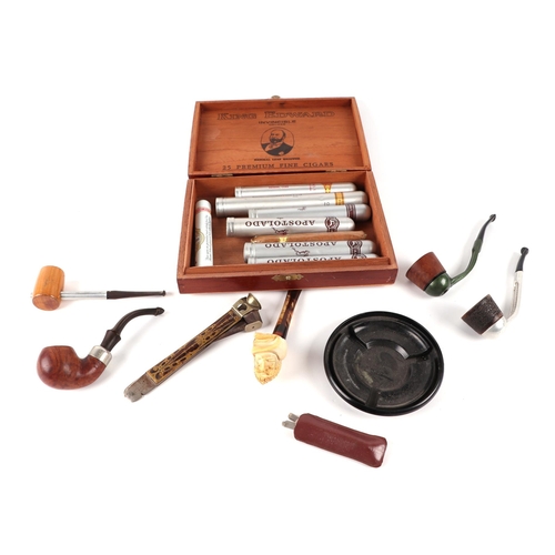 421 - A group of pipes to include a Meerschaum example; together with a brass inlaid cigar cutter, a King ... 