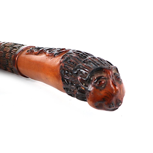 428 - An Indian walking stick with lion head terminal, 95cms long.