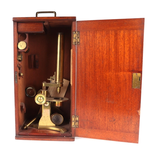 444 - A Baker of London Victorian brass monocular microscope fitted in a mahogany case.