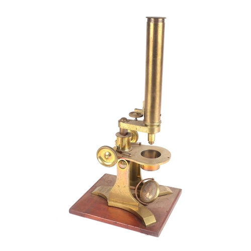 444 - A Baker of London Victorian brass monocular microscope fitted in a mahogany case.