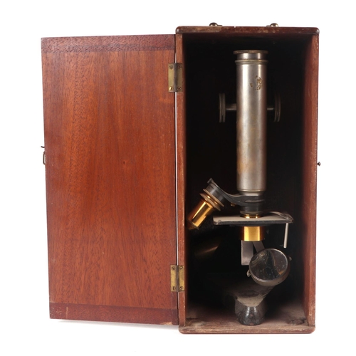 445 - A Beck of London monocular microscope fitted in a mahogany case (a/f).